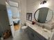 Chic bathroom with designer tile flooring, modern fixtures, and an adjoining bedroom at 65 Oglethorpe Ave, Clayton, NC 27527