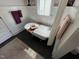 Charming bathroom with a clawfoot tub, floral wallpaper, and stylish decor at 65 Oglethorpe Ave, Clayton, NC 27527