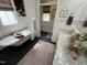 Bright bathroom with a clawfoot tub, marble countertops, and elegant decor at 65 Oglethorpe Ave, Clayton, NC 27527