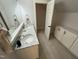 Modern bathroom featuring double sinks and a walk-in closet with built-in storage at 65 Oglethorpe Ave, Clayton, NC 27527