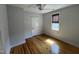 Inviting bedroom with a ceiling fan, neutral paint, and wood floors at 65 Oglethorpe Ave, Clayton, NC 27527