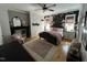 Charming bedroom features floral wallpaper, hardwood floors, and decorative fireplace at 65 Oglethorpe Ave, Clayton, NC 27527