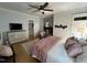 Charming bedroom with a fireplace, vintage decor, and warm hardwood floors at 65 Oglethorpe Ave, Clayton, NC 27527
