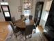 Cozy dining room with a round table, upholstered chairs, and elegant decor at 65 Oglethorpe Ave, Clayton, NC 27527