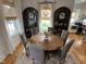 Elegant dining room with a rustic table, stylish chairs, and decorative shelving at 65 Oglethorpe Ave, Clayton, NC 27527