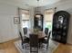 Charming dining room with seating for six, wood floors, decorative cabinets, and ample natural light at 65 Oglethorpe Ave, Clayton, NC 27527