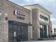 Exterior view of RaRamen and PureGreen restaurants in a modern, brick-facade building at 65 Oglethorpe Ave, Clayton, NC 27527