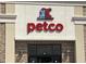Exterior view of a PETCO store with a clean, modern design and clear signage for pet owners at 65 Oglethorpe Ave, Clayton, NC 27527
