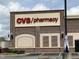 The CVS/pharmacy building features classic brickwork, cream accents, and well-lit exteriors, perfect for evening visits at 65 Oglethorpe Ave, Clayton, NC 27527
