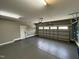 Spacious three-car garage, featuring a light gray epoxy floor and ample storage at 65 Oglethorpe Ave, Clayton, NC 27527