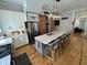 Bright kitchen with large island featuring counter seating, stainless appliances, and sliding wooden doors at 65 Oglethorpe Ave, Clayton, NC 27527
