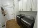 Convenient laundry area featuring modern appliances and ample storage space, seamlessly integrated into the home at 65 Oglethorpe Ave, Clayton, NC 27527