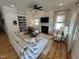 Bright living room features a fireplace, built-in shelving, and hardwood floors at 65 Oglethorpe Ave, Clayton, NC 27527