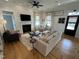 Bright and airy living room with a fireplace, hardwood floors, and comfortable seating at 65 Oglethorpe Ave, Clayton, NC 27527