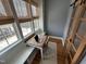 Bright office features a built in desk with three windows providing natural light and neighborhood views at 65 Oglethorpe Ave, Clayton, NC 27527