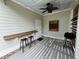 Outdoor bar area with a wooden bar and seating for two at 65 Oglethorpe Ave, Clayton, NC 27527