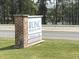 Roadside sign for UNC Health Care Primary Care Urgent Care services at 65 Oglethorpe Ave, Clayton, NC 27527