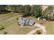 Scenic aerial view of a home nestled among tall trees and with a long driveway at 664 Marler Rd, Benson, NC 27504