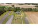 Aerial view with property lines approximated of home nestled among expansive farmland and lush greenery at 664 Marler Rd, Benson, NC 27504