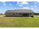 Spacious backyard featuring a screened-in porch, offering a relaxing outdoor space at 664 Marler Rd, Benson, NC 27504