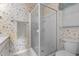 Bathroom featuring a shower, toilet, and floral wallpaper at 664 Marler Rd, Benson, NC 27504