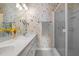 Bathroom featuring a dual vanity, mirror and wallpaper at 664 Marler Rd, Benson, NC 27504