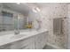 Bathroom featuring a dual vanity, mirror and wallpaper at 664 Marler Rd, Benson, NC 27504