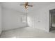 Bedroom with a ceiling fan, a window, and a double door closet at 664 Marler Rd, Benson, NC 27504