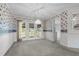 Formal dining room with floral wallpaper and access to the backyard at 664 Marler Rd, Benson, NC 27504