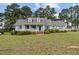 Charming single-story home with a cozy front porch and well-maintained landscaping at 664 Marler Rd, Benson, NC 27504
