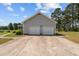 Detached two-car garage with ample parking space on a paved driveway at 664 Marler Rd, Benson, NC 27504