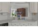 Bright kitchen with a sink, neutral countertops, and cabinetry at 664 Marler Rd, Benson, NC 27504