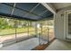 Screened in porch with brick detail and lawn views at 664 Marler Rd, Benson, NC 27504