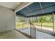 Screened in porch looking out onto a green lawn at 664 Marler Rd, Benson, NC 27504