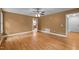 Spacious bedroom with hardwood flooring, natural light, and a view into the bathroom at 707 Sinai Cir, Hillsborough, NC 27278