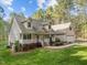 Charming two-story home with inviting front porch, manicured landscaping, and a well-maintained lawn at 707 Sinai Cir, Hillsborough, NC 27278