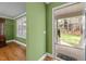 Entrance foyer with hardwood floors and view to living room and front porch at 707 Sinai Cir, Hillsborough, NC 27278