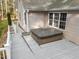 Hot tub installed on the back deck provides relaxation and enjoyment near windows and access to the home at 707 Sinai Cir, Hillsborough, NC 27278