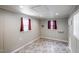 Finished bonus room above garage with natural light, featuring modern flooring and neutral walls, ideal for a home office or studio at 707 Sinai Cir, Hillsborough, NC 27278