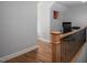 Hallway with wood floors leading to an office with desk and chair at 711 Kentcie Ln, Efland, NC 27243