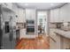 Well-appointed kitchen with stainless steel appliances, granite countertops, and ample cabinet space at 711 Kentcie Ln, Efland, NC 27243
