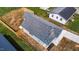 Aerial of a newly constructed home with a wood fence and a new roof at 815 Goshen St, Oxford, NC 27565