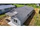 Aerial view of a charming single-story home with gray siding and manicured landscaping at 815 Goshen St, Oxford, NC 27565