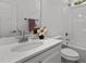 Bathroom featuring a white countertop sink and shower with neutral fixtures at 815 Goshen St, Oxford, NC 27565