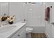 Bathroom featuring a white countertop sink and shower with neutral fixtures at 815 Goshen St, Oxford, NC 27565