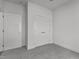 Neutral bedroom featuring two doors and neutral carpet at 815 Goshen St, Oxford, NC 27565