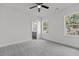 Spacious bedroom with neutral carpet and ample natural light, leading to a view of the en-suite bathroom at 815 Goshen St, Oxford, NC 27565