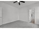 This bedroom is a blank canvas with neutral carpet and ceiling fan, ready for your personal touch at 815 Goshen St, Oxford, NC 27565