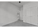 Neutral bedroom featuring two doors and neutral carpet at 815 Goshen St, Oxford, NC 27565
