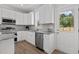 Modern kitchen with white cabinets, granite countertops, and stainless steel appliances at 815 Goshen St, Oxford, NC 27565